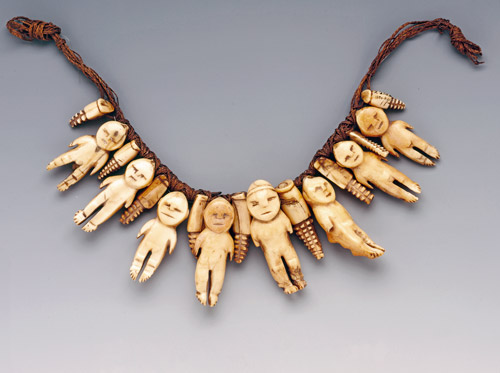 Necklace with eight ivory figures housed at the Museum of Archaeology and Anthropology